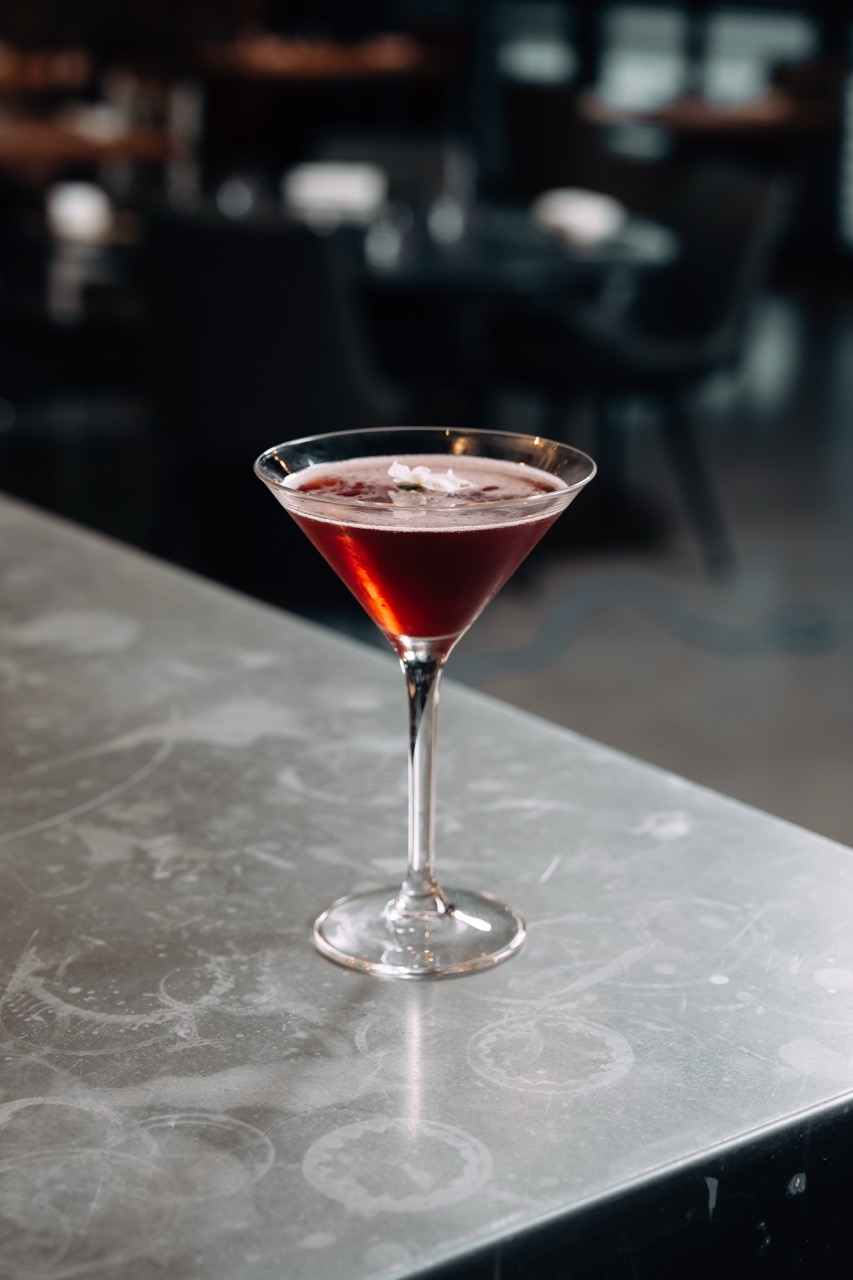 Sparkling cocktail with rosemary garnish